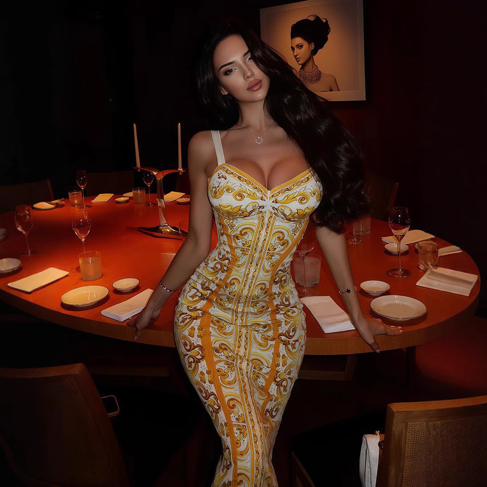Woman in a patterned dress standing in a dimly lit restaurant.